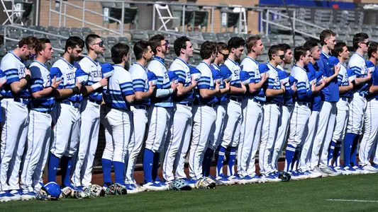 The Seton Hall baseball team stands for the National Anthem before a game at the MLB Desert Invitational