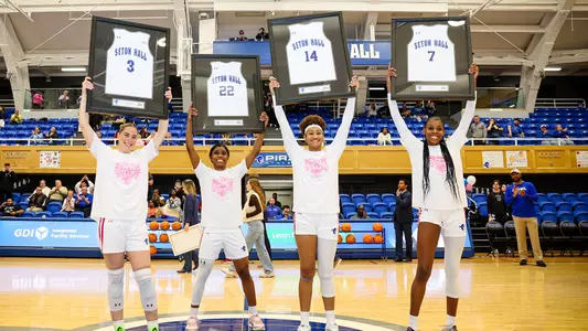 The 2025 seniors holding their plaques.