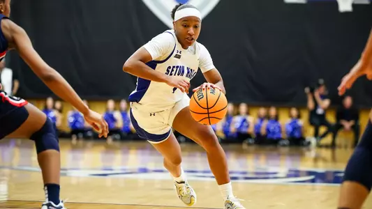 Joniyah Bland-Fitzpatrick drives past a defender