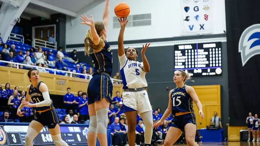 Savannah Catalon floats the ball over the Quinnipiac defense for a score on March 20.