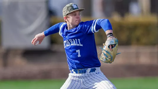 Stephen Curry throws a pitch against Saint Joseph's