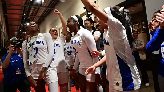 Members of the Seton Hall women's basketball team celebrate after defeating Xavier on March 8