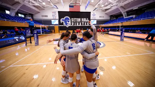 Members of the Seton Hall volleyball team huddle prior to a match against NJIT during the 2024 season.