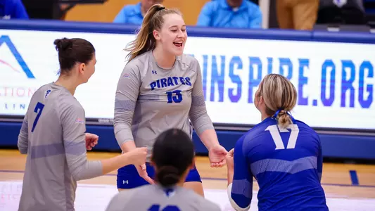 Maddy Loiselle and her teammates celebrate a point during a 2024 match.