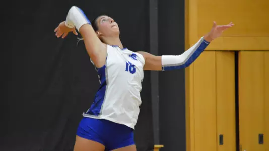 Sadie Reich serves during a blue-white scrimmage.