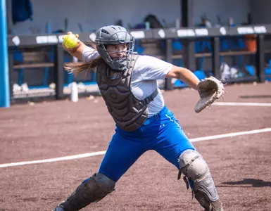 Lea Kosinski throwing in catchers gear