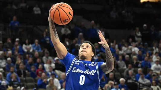 Feb 7, 2026; Omaha, Nebraska, USA; Seton Hall Pirates guard Adam Clark (0) scores against the Creighton Bluejays during the first half at CHI Health Center Omaha. Mandatory Credit: Steven Branscombe-Imagn Images
