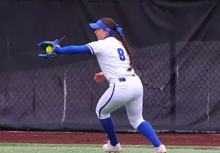 Olivia Chavez catching in outfield