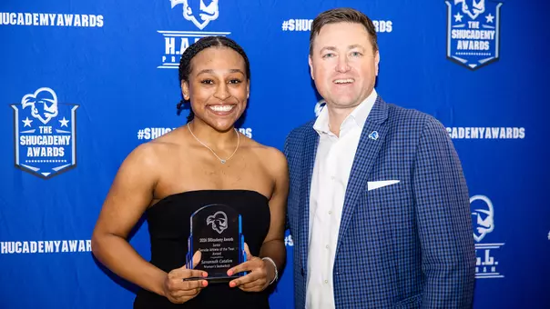 Savannah Catalon Accepting Junior Athlete of the Year from Bryan Felt