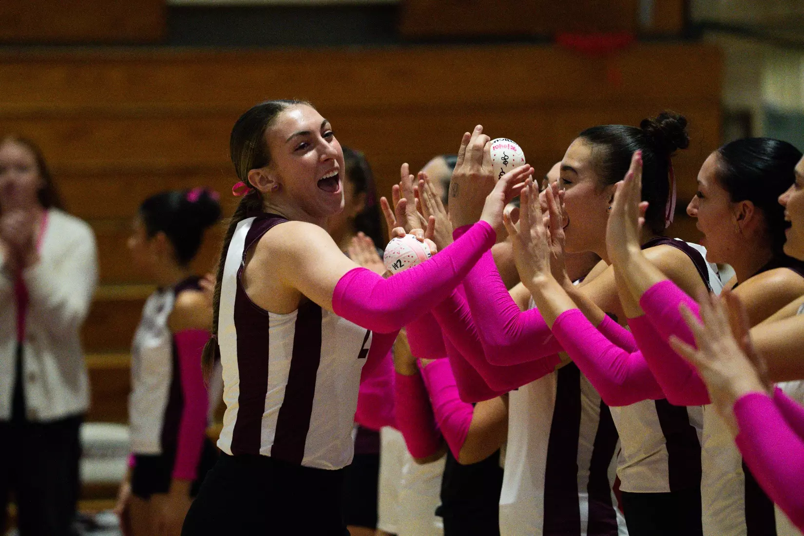 Natalie Vance high fives her team as her name is announced.