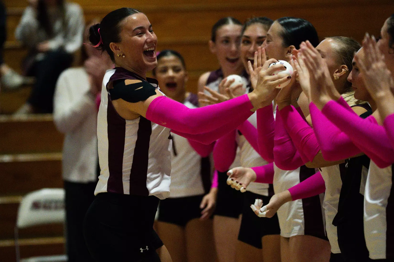 McKenzie Moeller high fives her team as her name is announced.