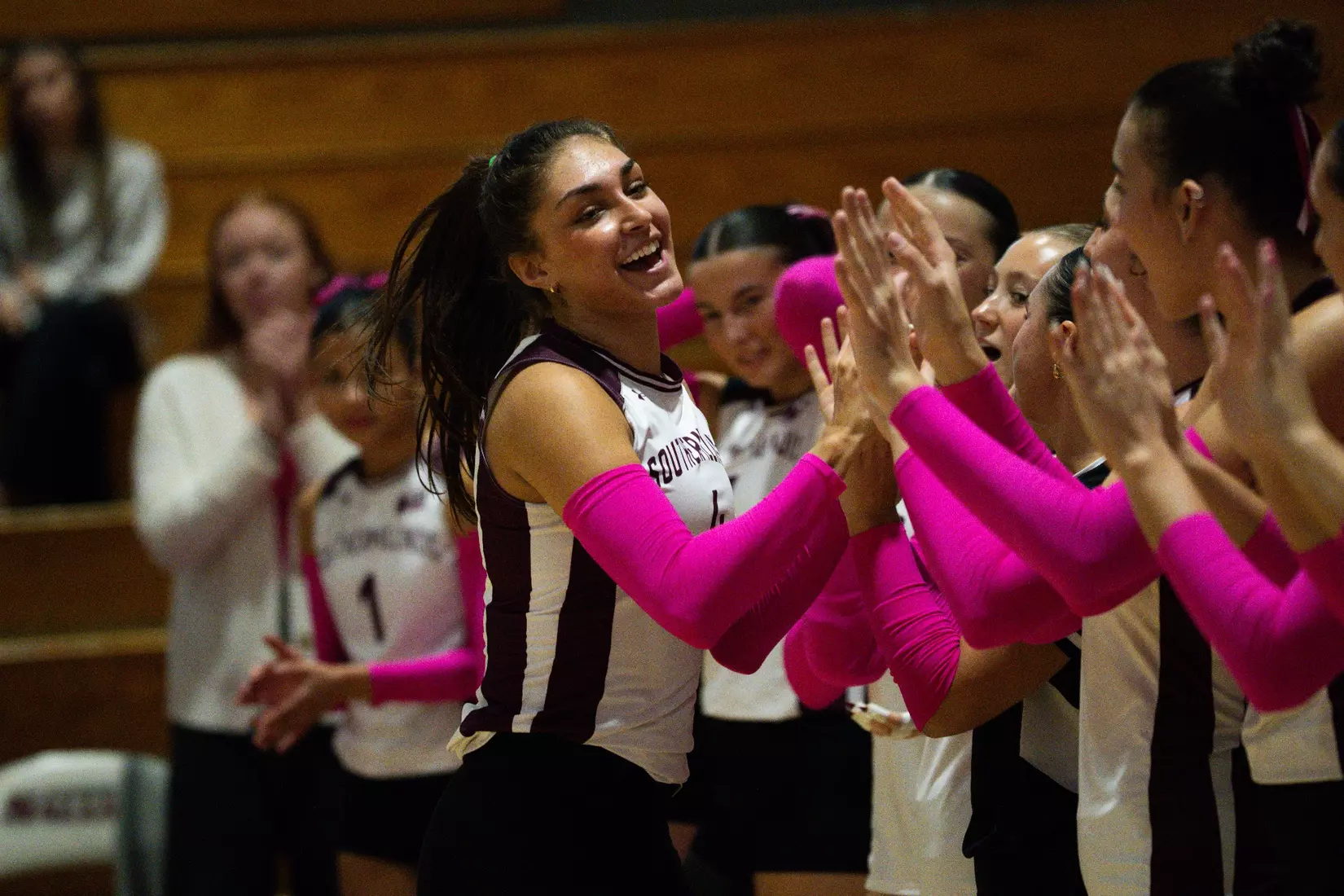 Ella McFarland high fives her team as her name is announced.
