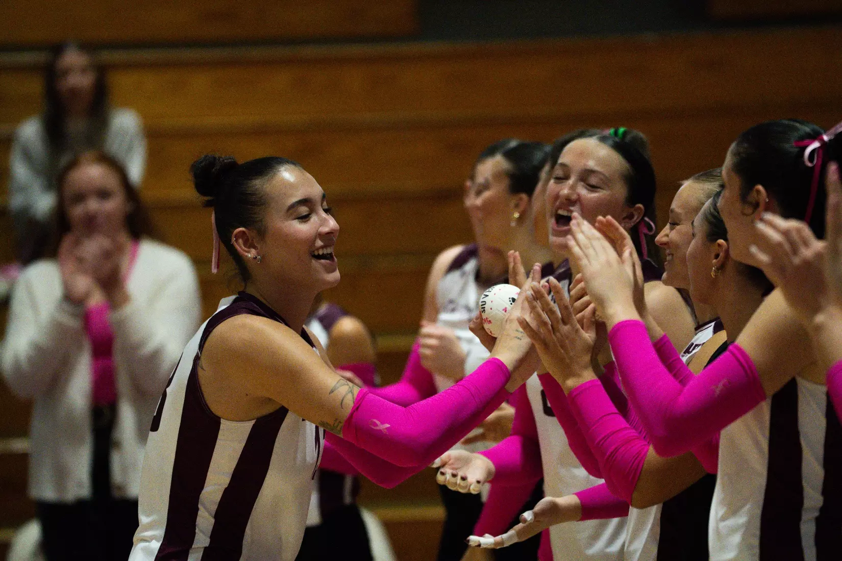 Beatriz Piaia high fives her team as her name is announced.