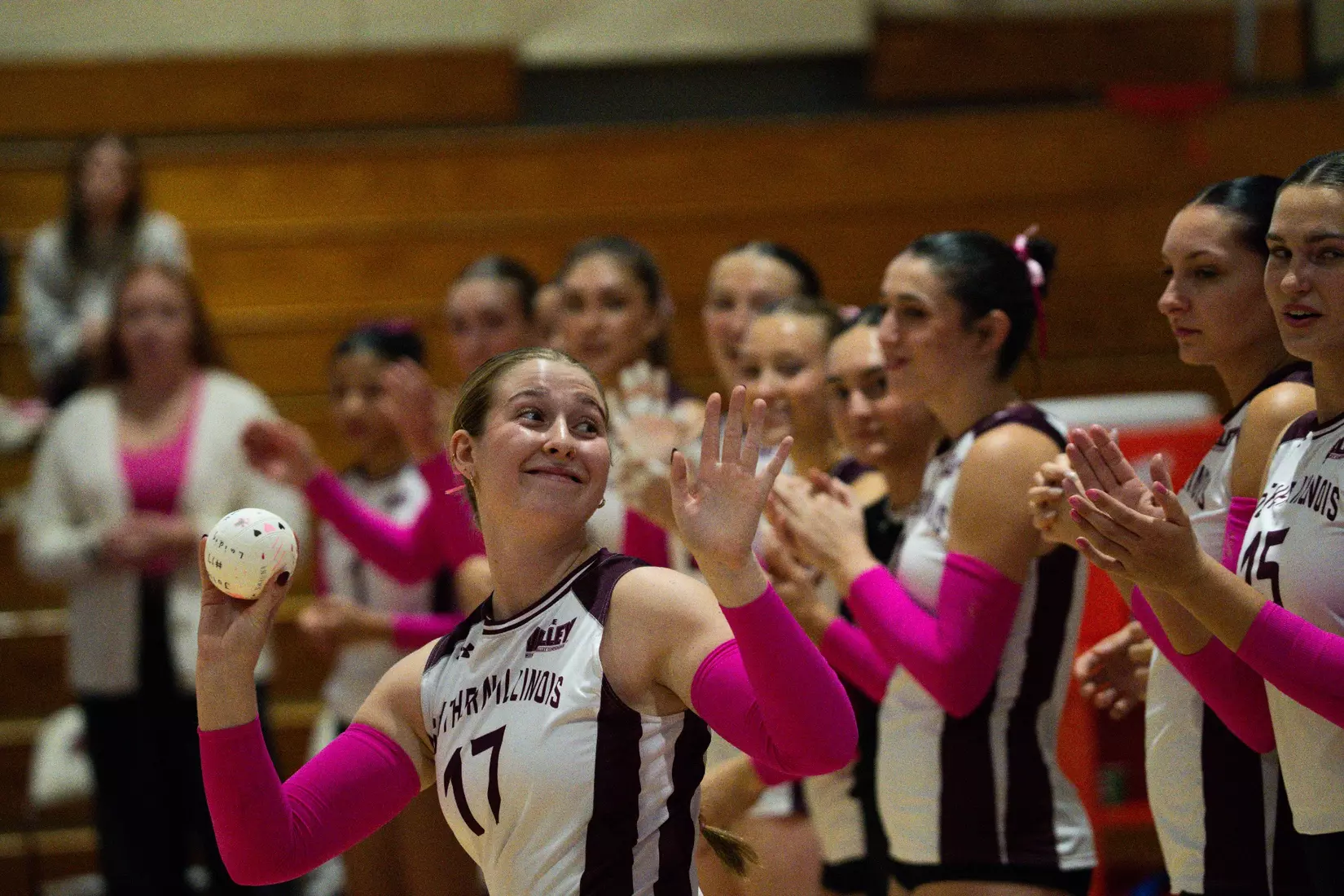 Julia Laidig smiles and waves to the fans at Davies Gym.