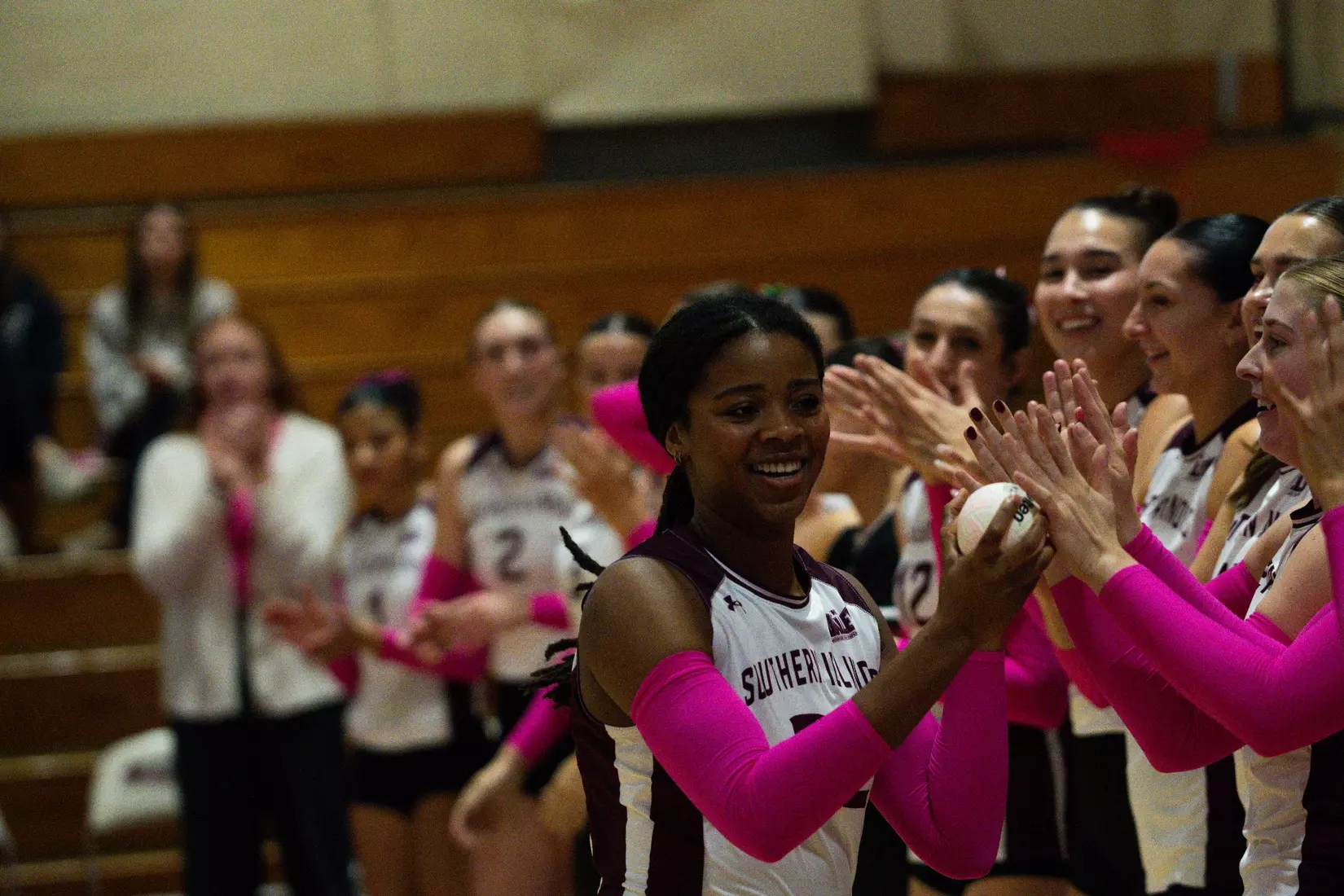 Chloe Anderson high fives her team as her name is announced.