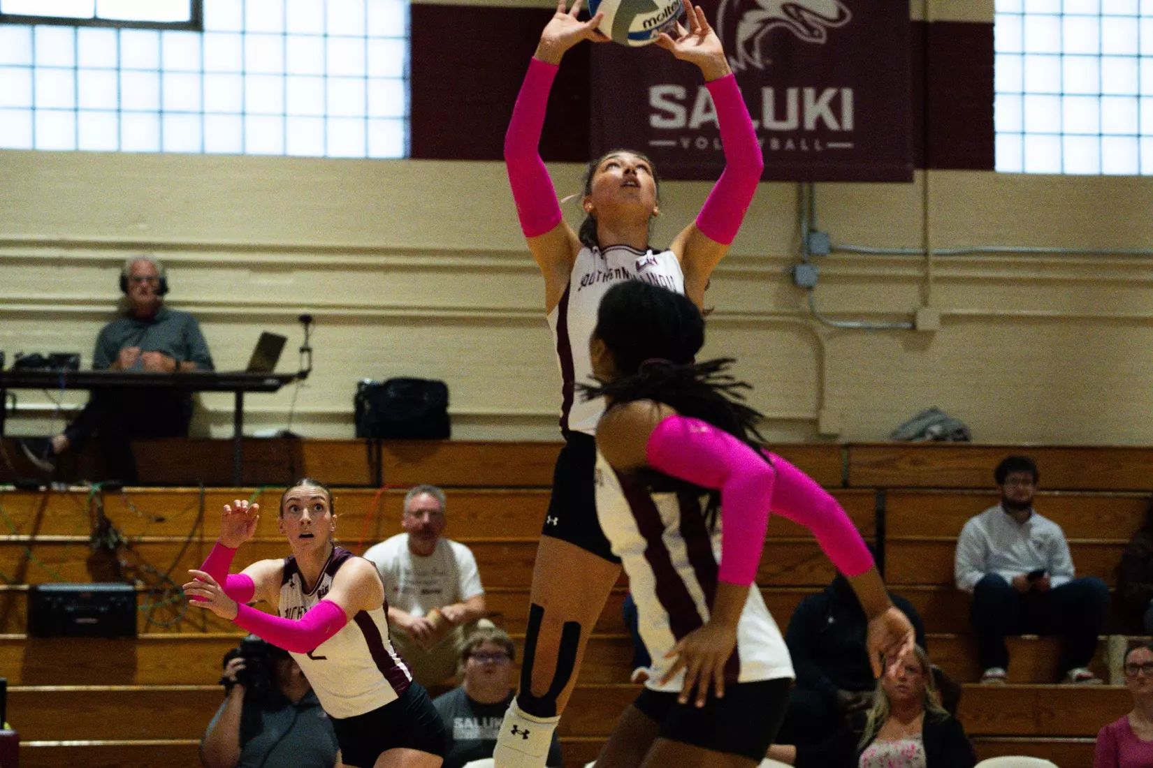 Ella McFarland sets a ball.
