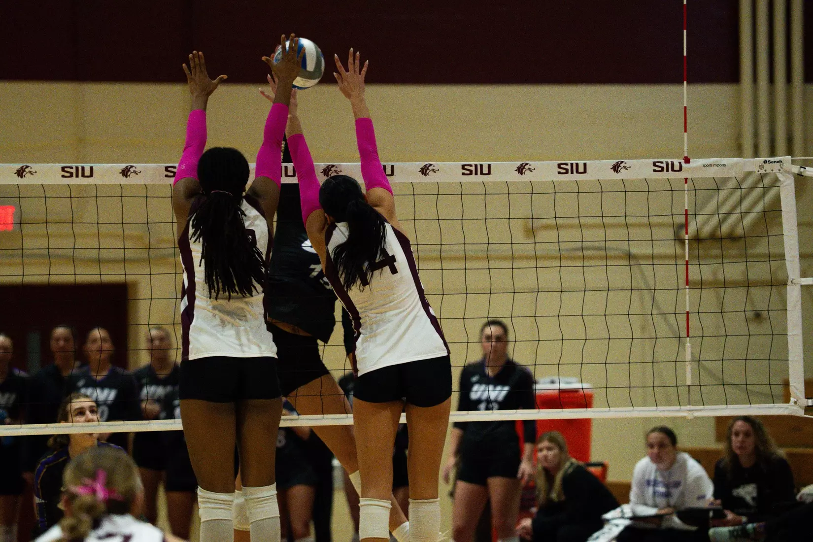Ella Swansiger and Chloe Anderson go up for a block.