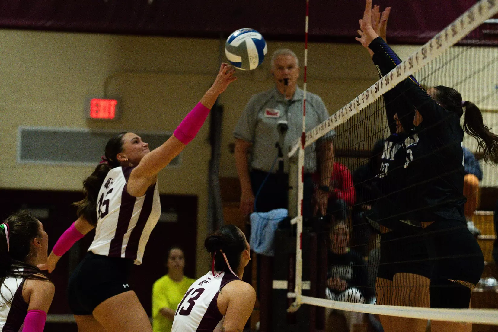 Ida Almkvist tips a ball over the net.