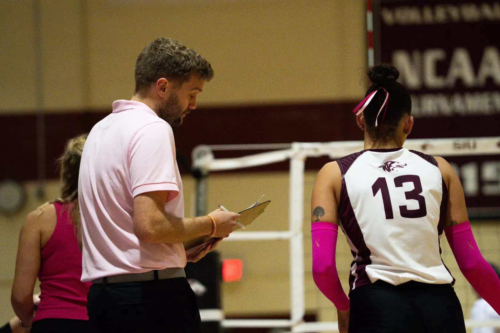 Assistant Coach Chris Yates gives feedback to Beatriz Piaia.