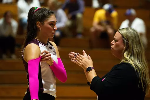 Head Coach Brittany Harry talks to Ella McFarland.