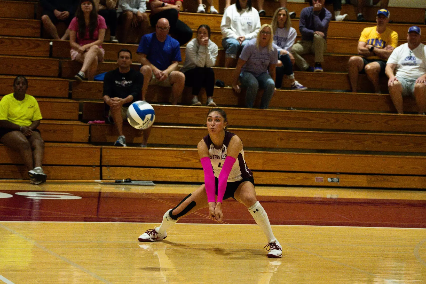 Ella McFarland prepares to receive a ball.