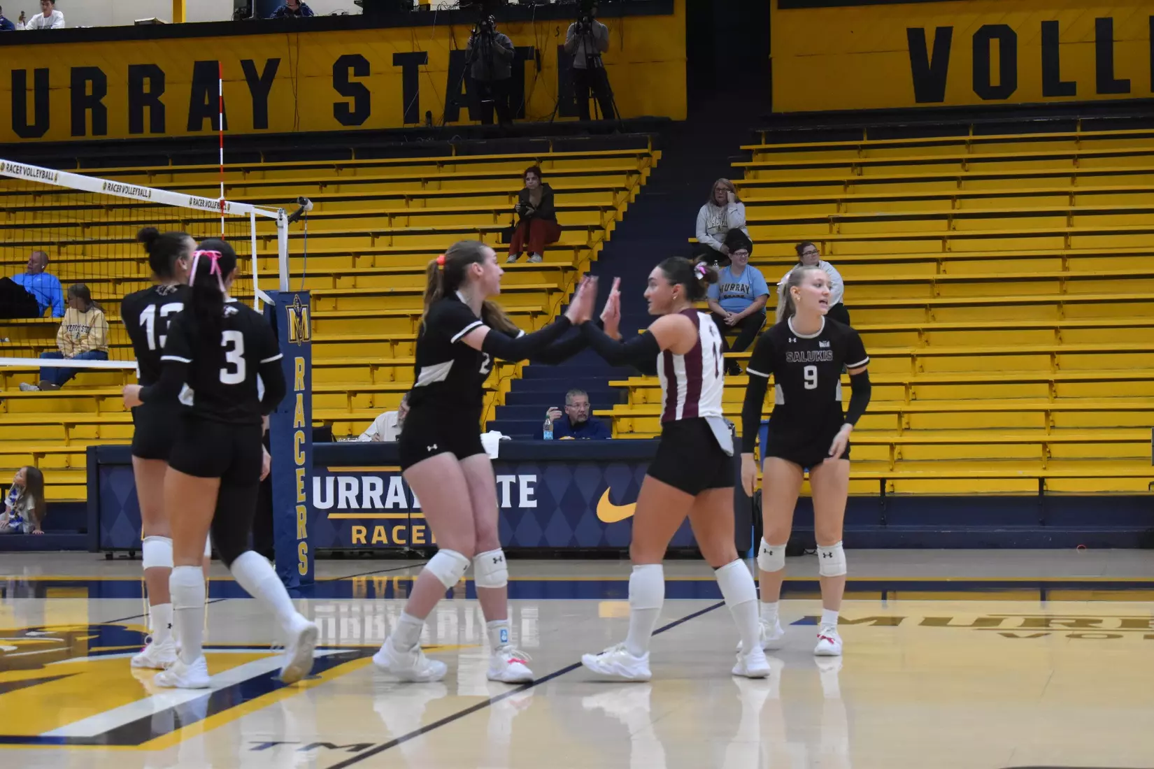 Jillian Shaneyfelt and Natalie Vance high five.