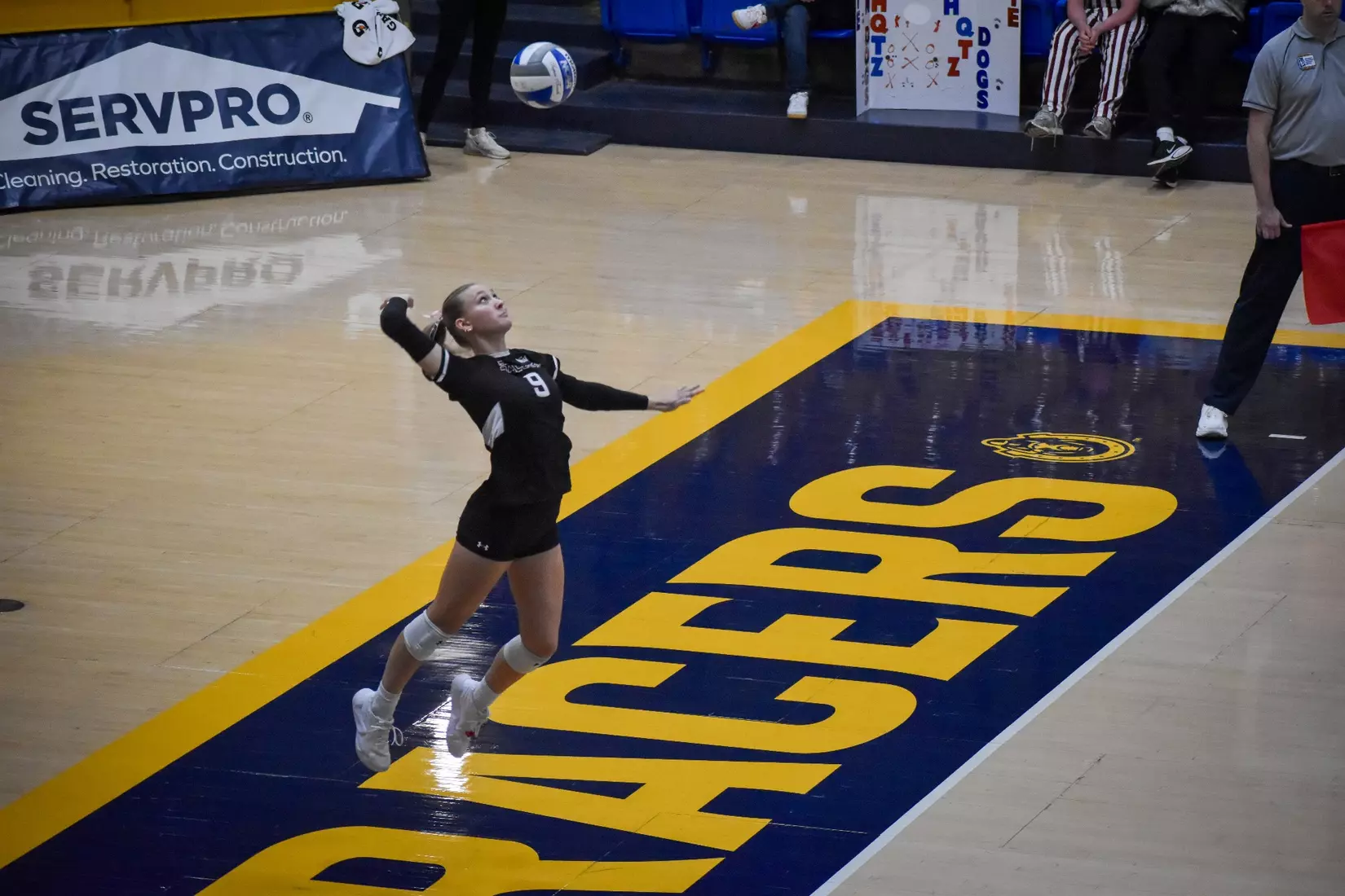 Lillian Dempkey serves a ball.