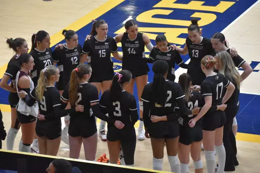 Head Coach Brittany Harry talks to her team during a timeout.