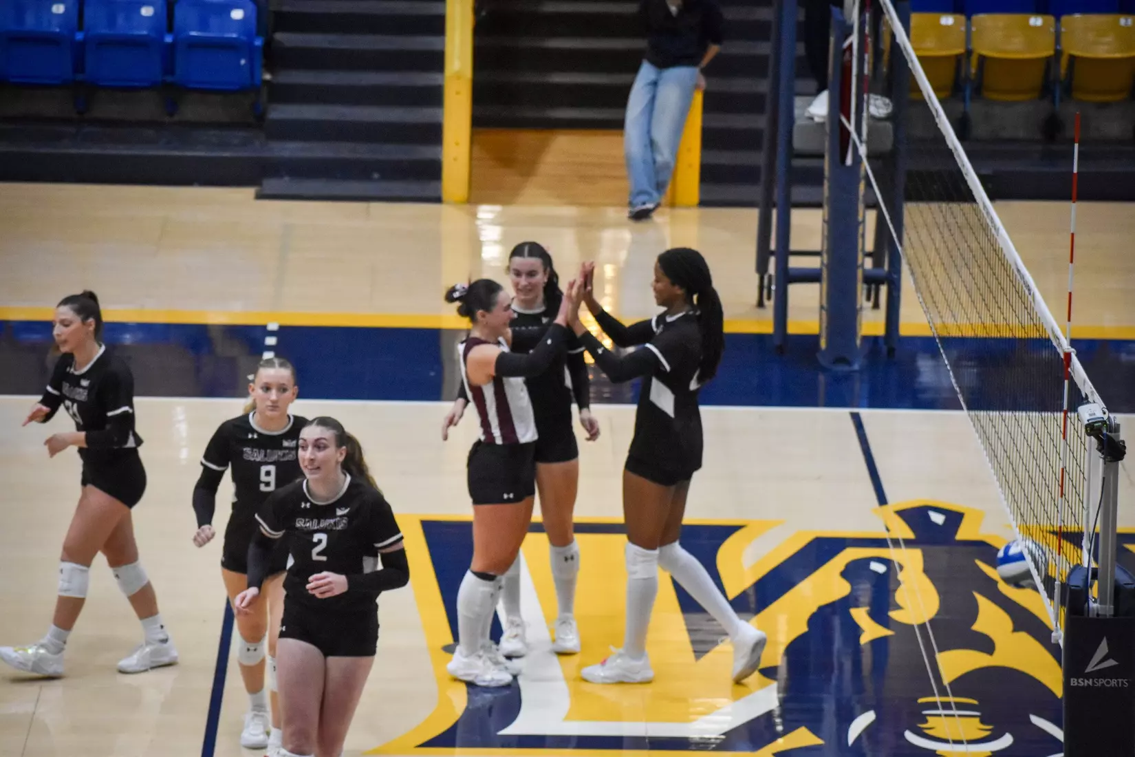 Jillian Shaneyfelt and Chloe Anderson high five.