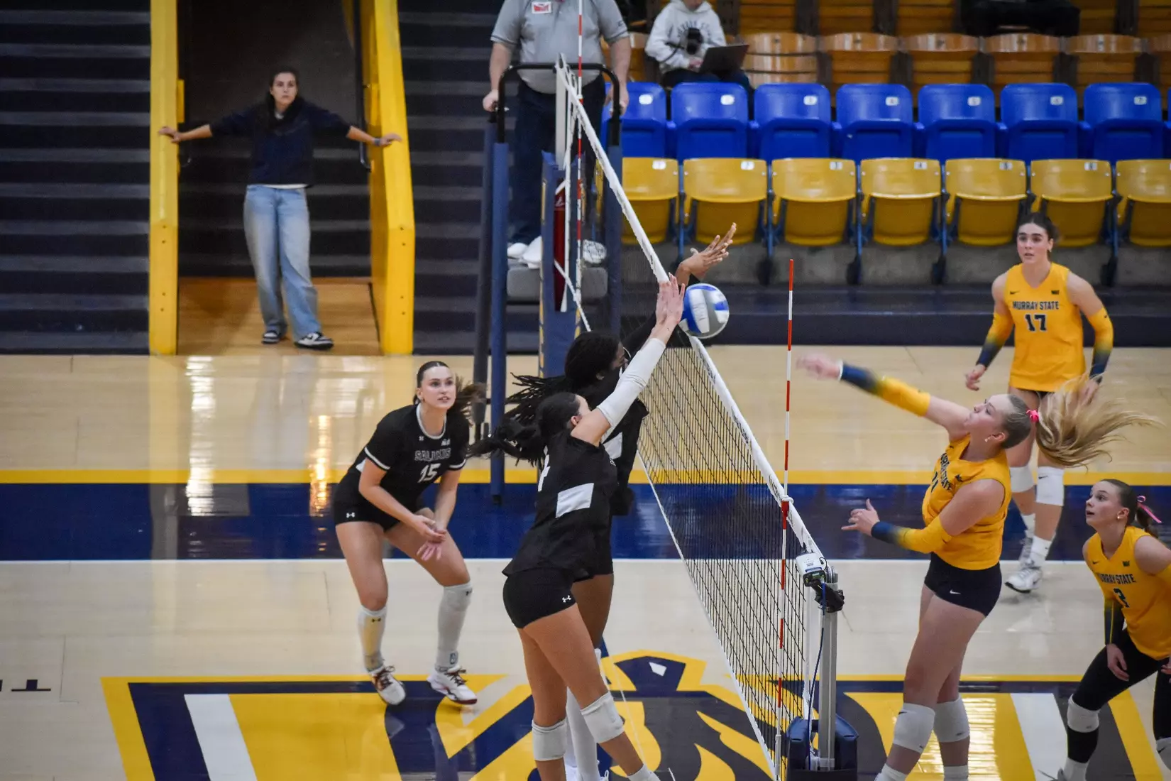Chloe Anderson and Ella Swansiger block a ball.