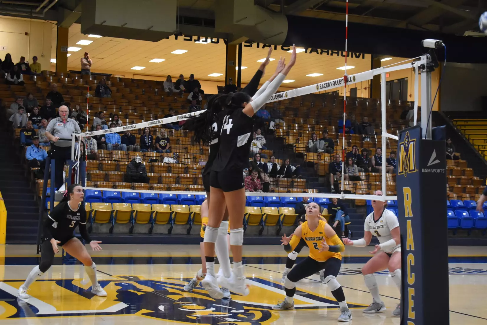 Chloe Anderson and Ella Swansiger go up for a block.