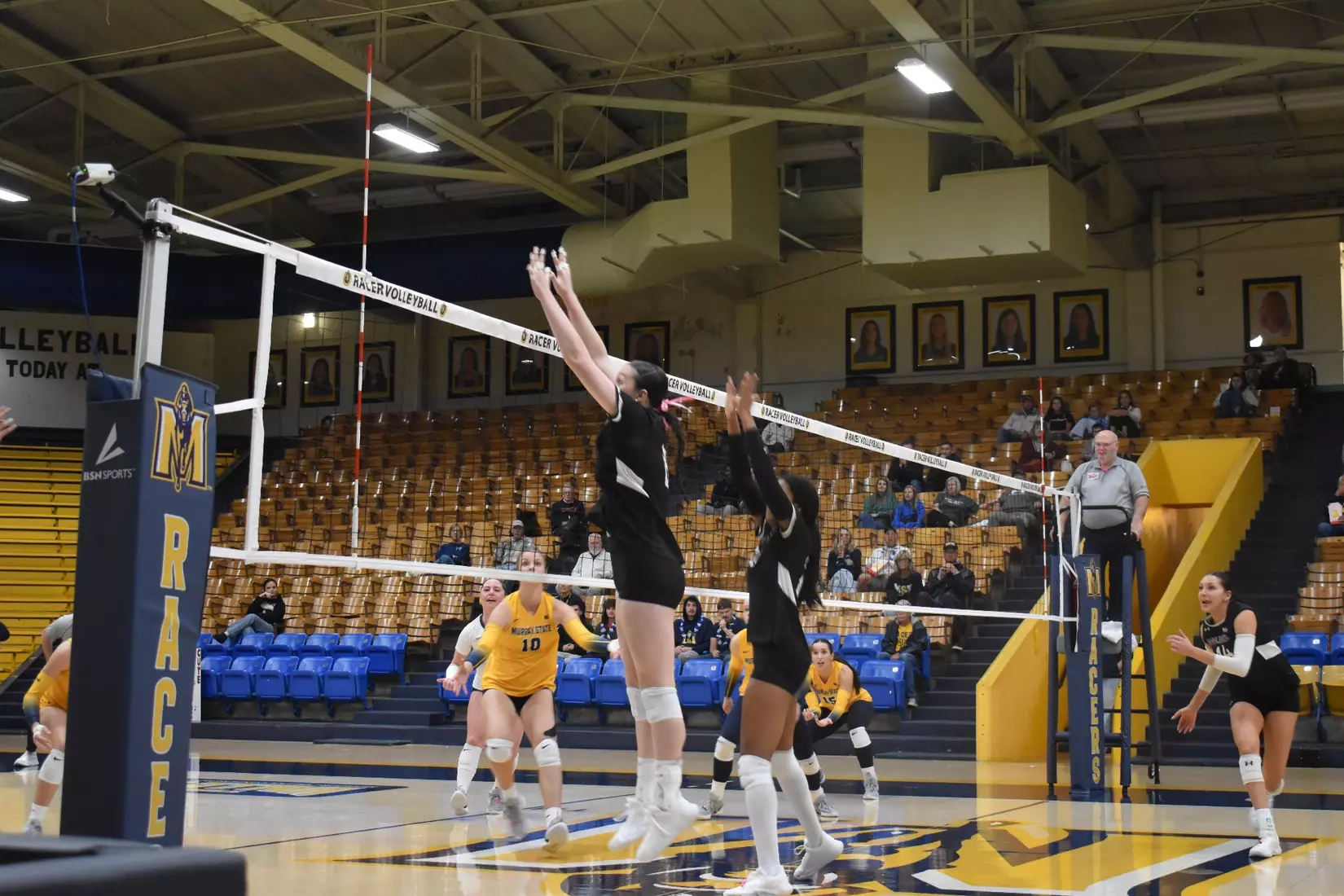 Alexandria Arrington and Chloe Anderson go up for a block.