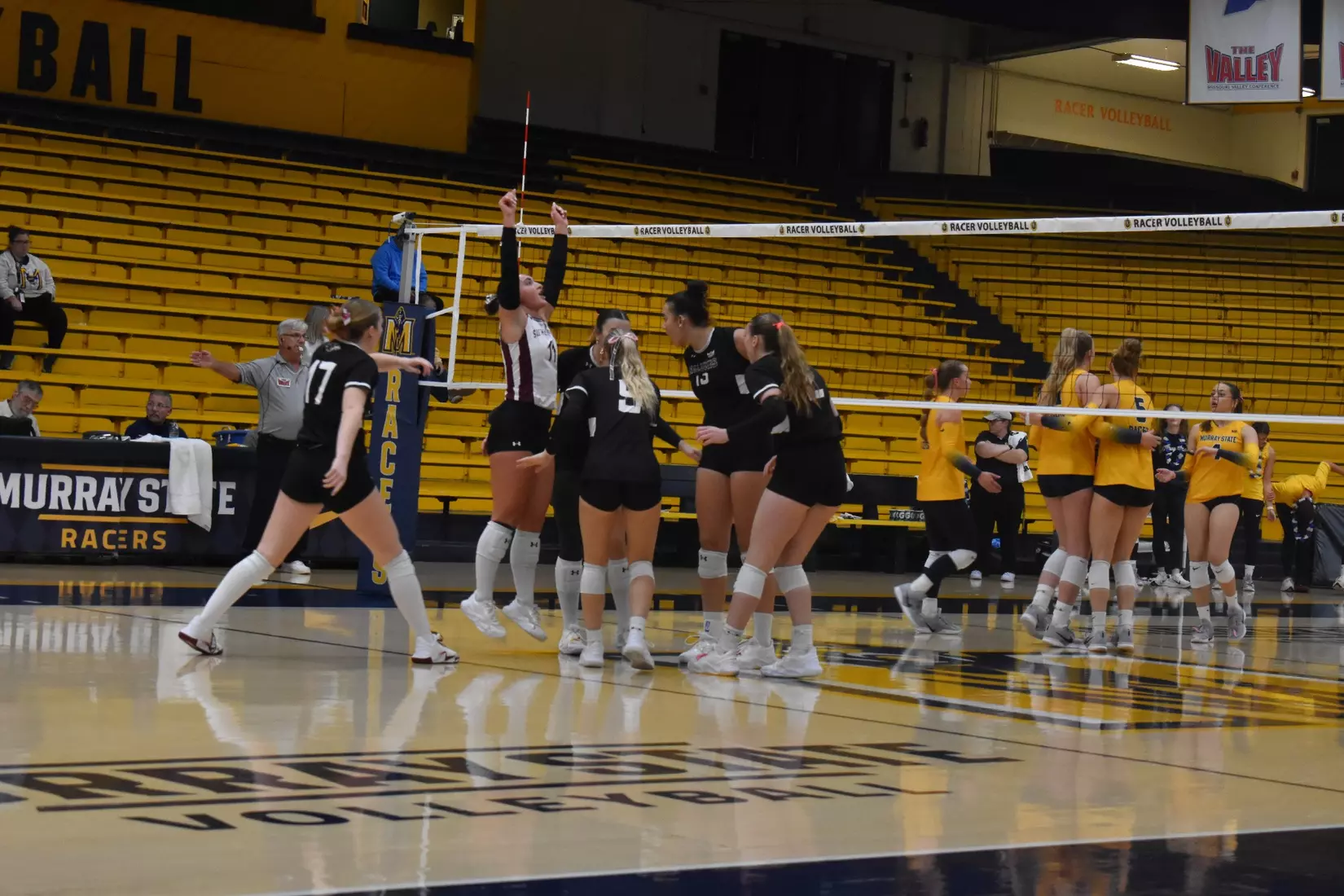 The team celebrates after a point.