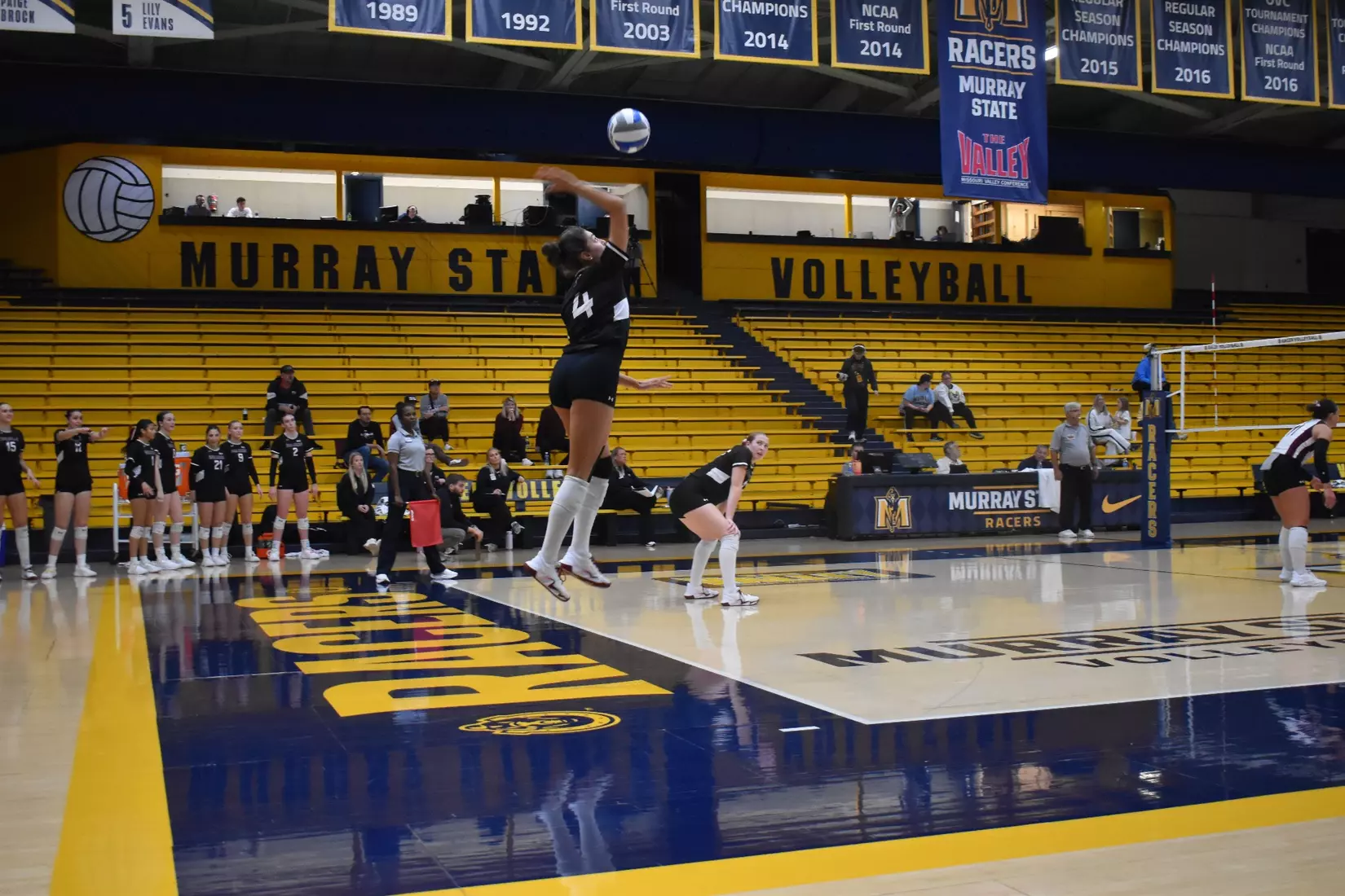 Ella McFarland serves a ball.