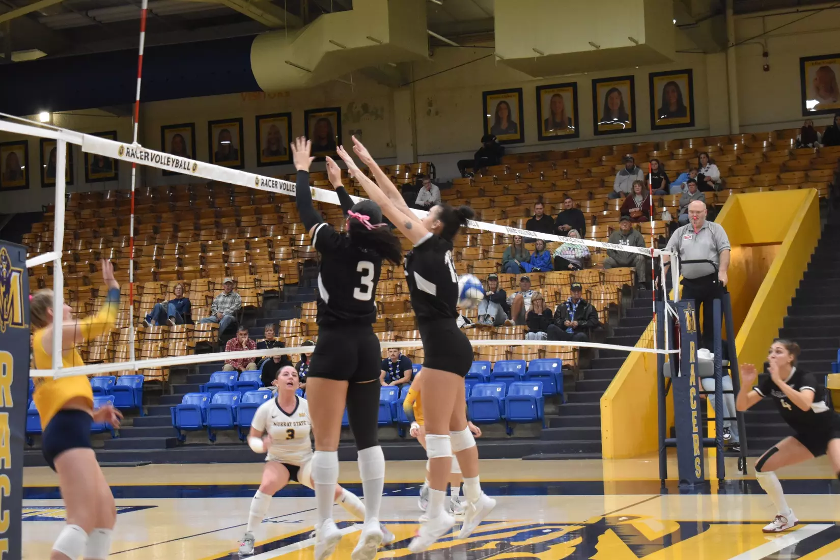 McKenzie Moeller and Beatriz Piaia go up for a block.