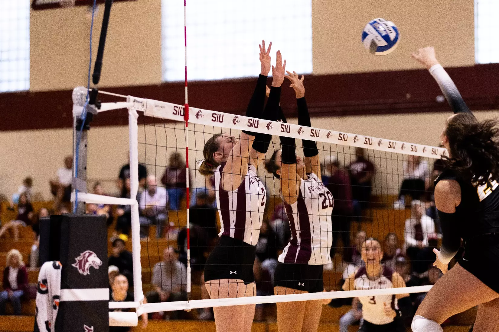 Natalie Vance and Valentina Zevallos go up for a block.