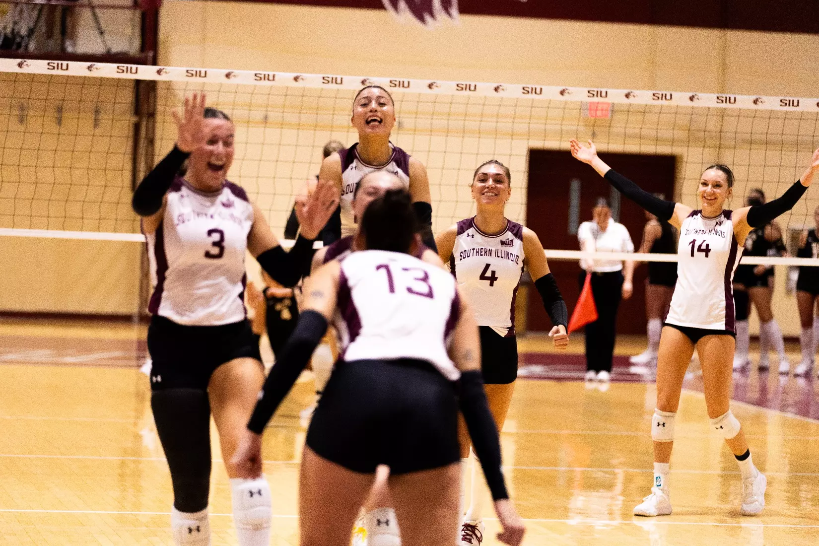 The team celebrates after a point.