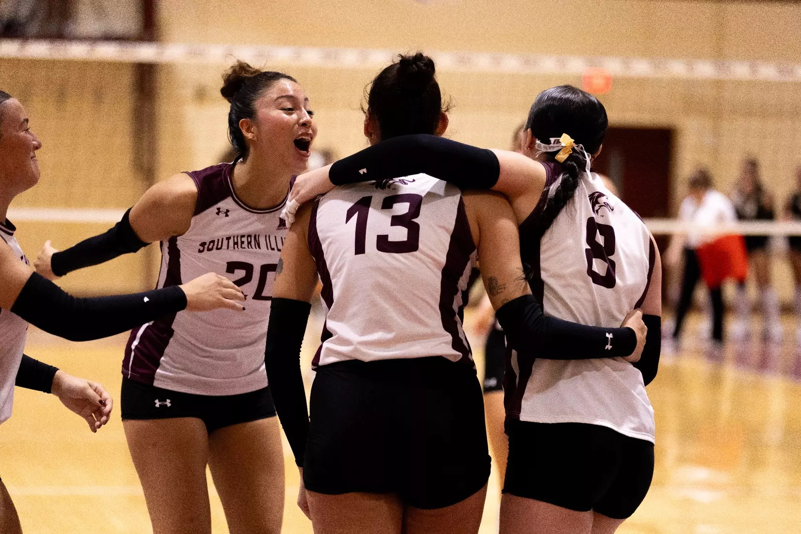 The team celebrates after a point.
