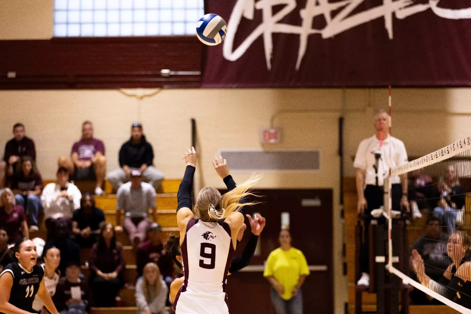 Lillian Dempkey sets a ball in the match.
