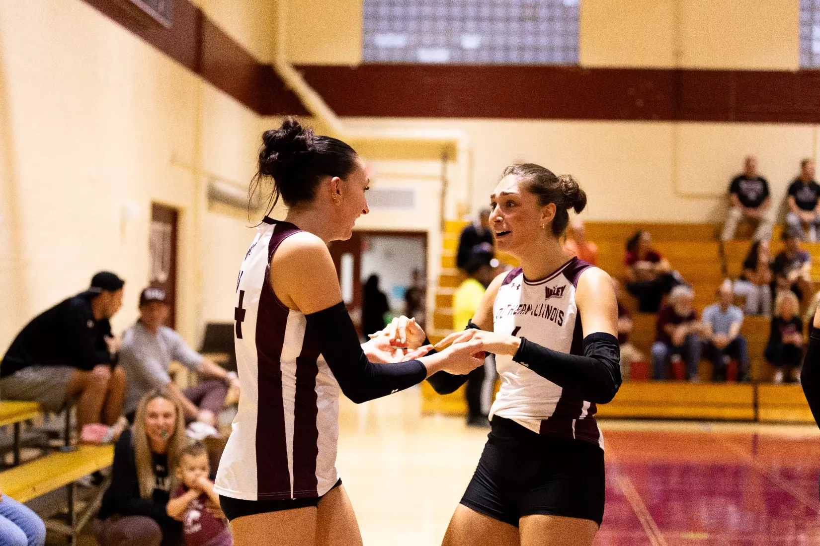 Ella McFarland and Ella Swansiger high five in the match.