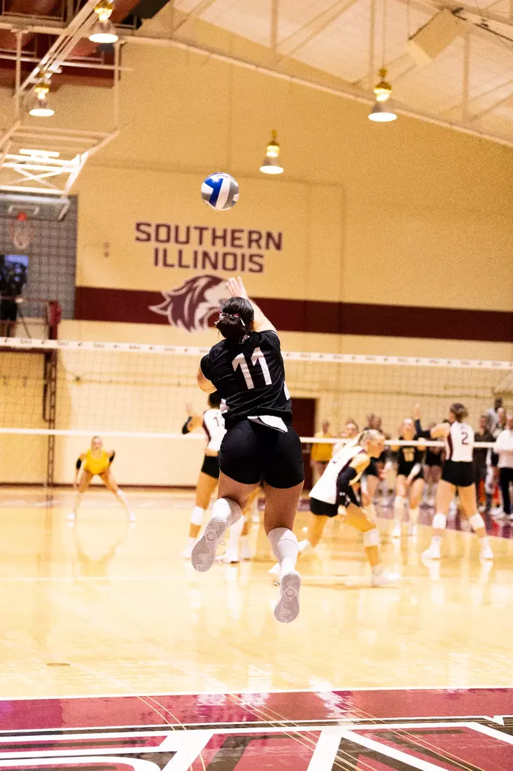 Jillian Shaneyfelt serves a ball in the match.