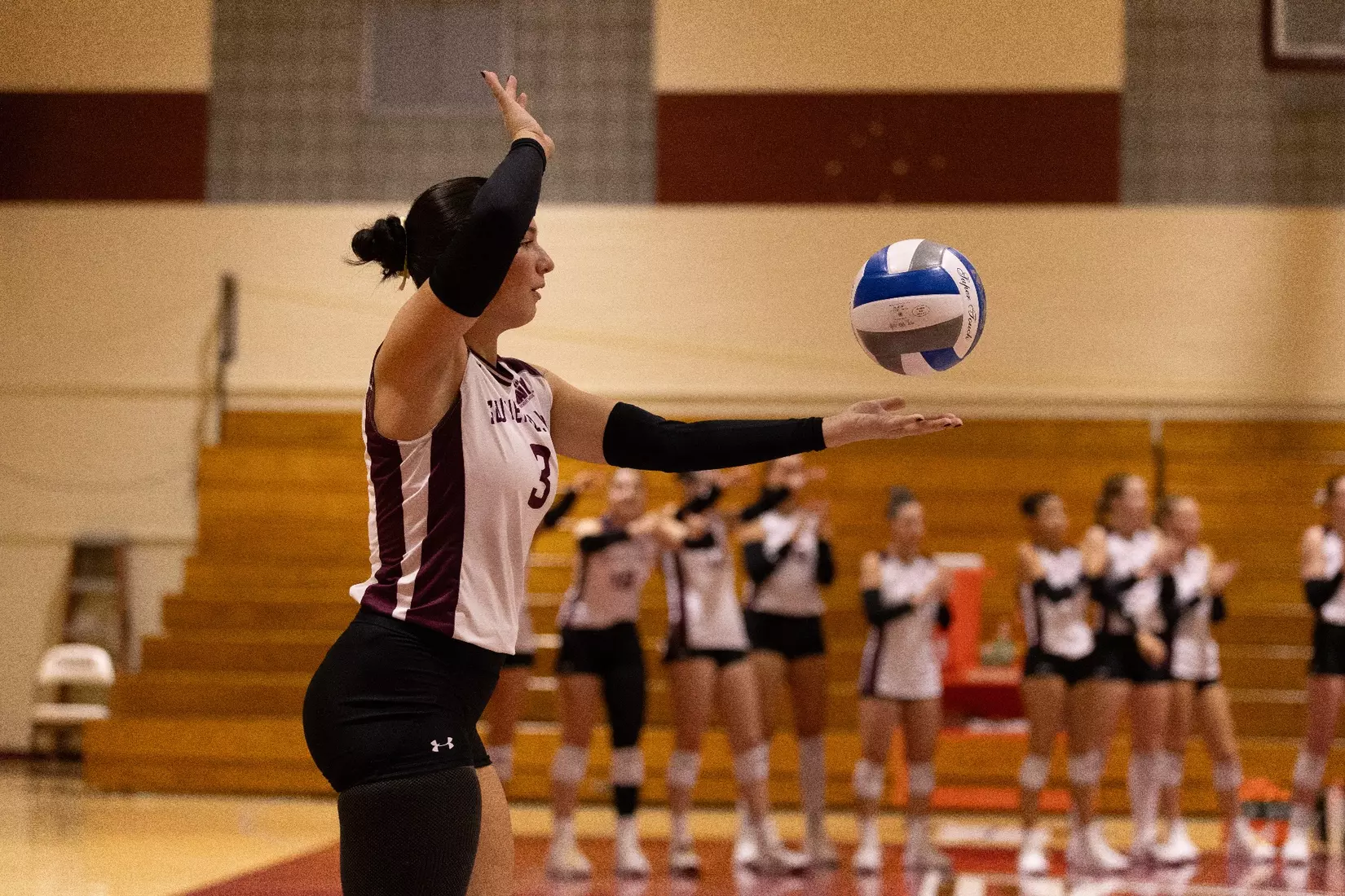 McKenzie Moeller prepares to serve a ball.