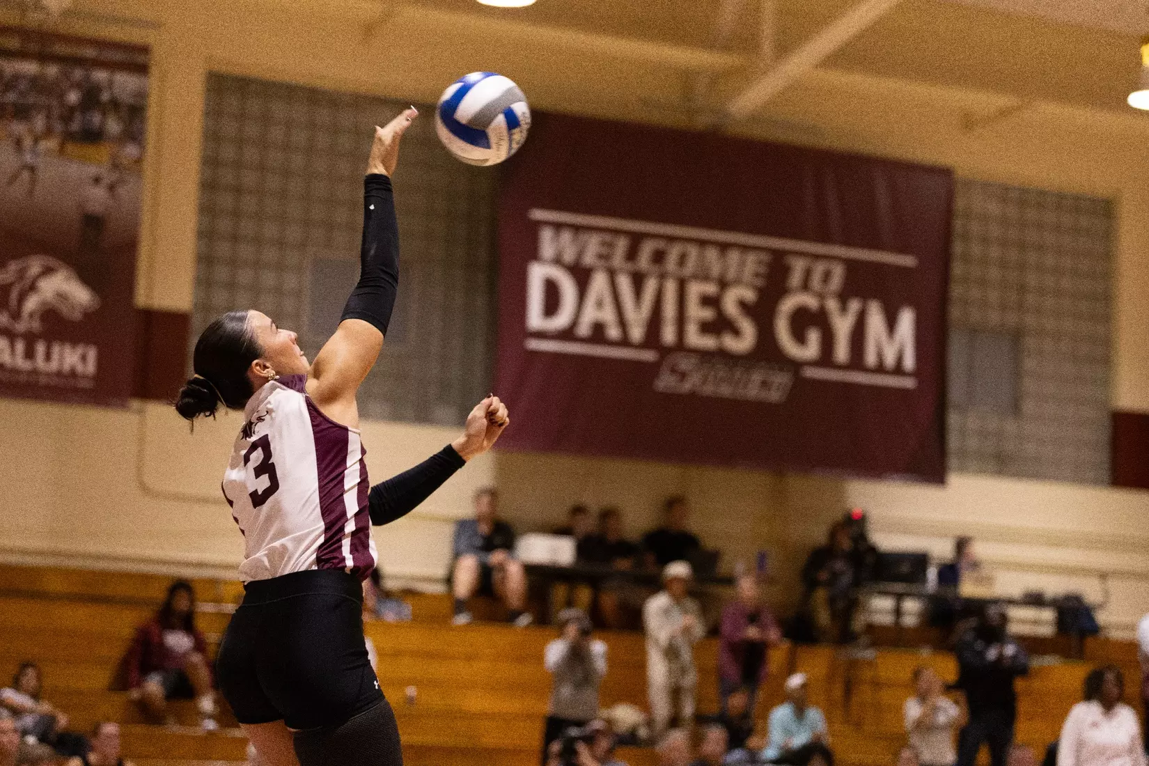 McKenzie Moeller serves a ball in the match.