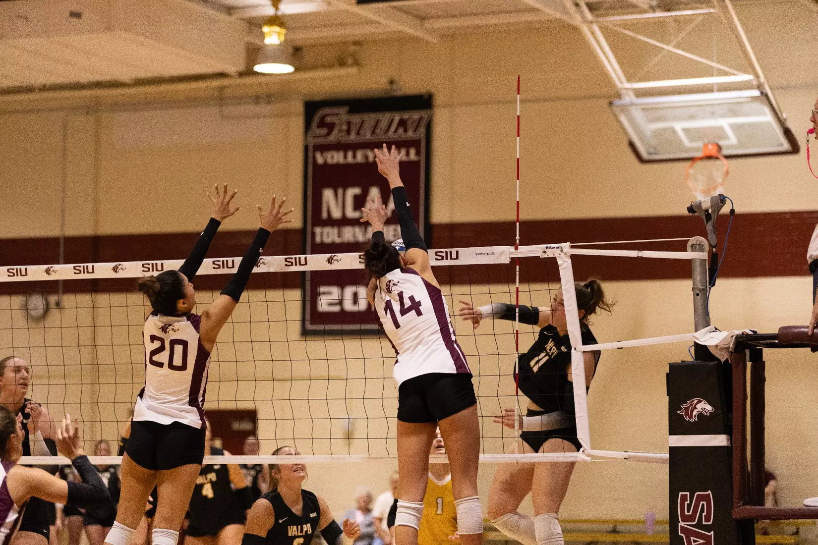Ella Swansiger and Valentina Zevallos go up for a block.