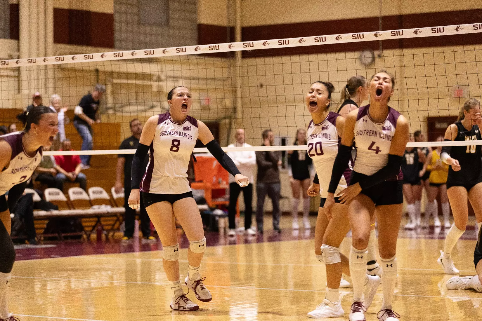 The team celebrates after a point.