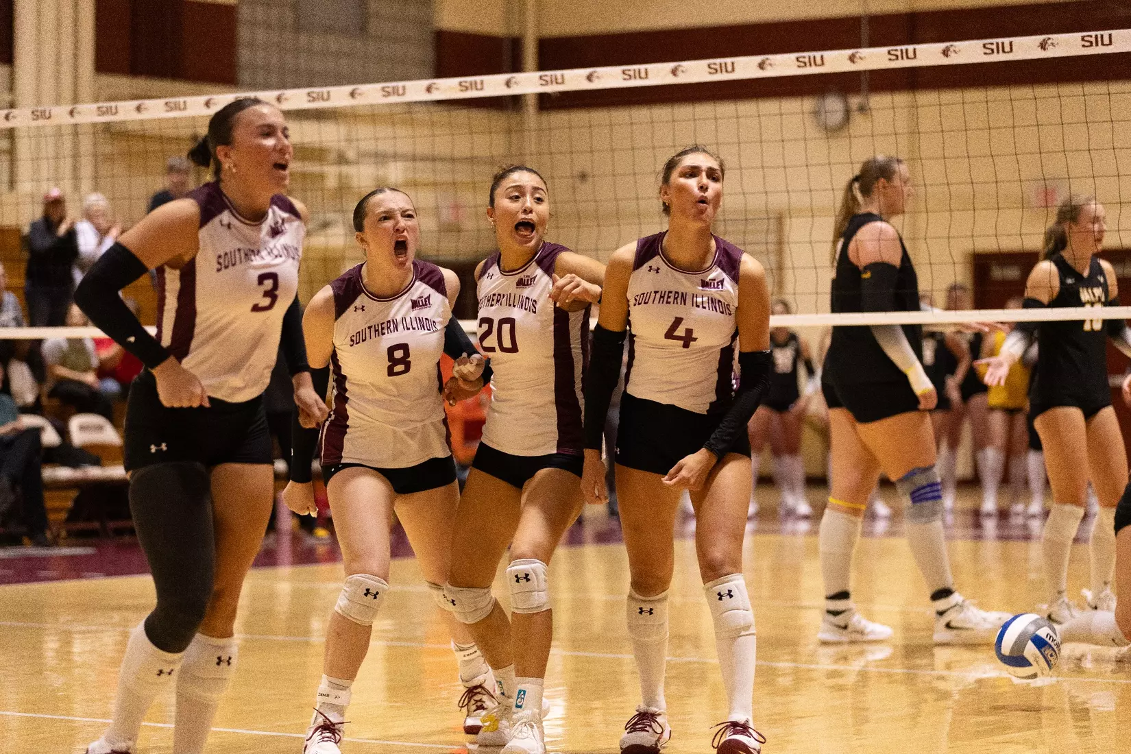 The team celebrates after a point.