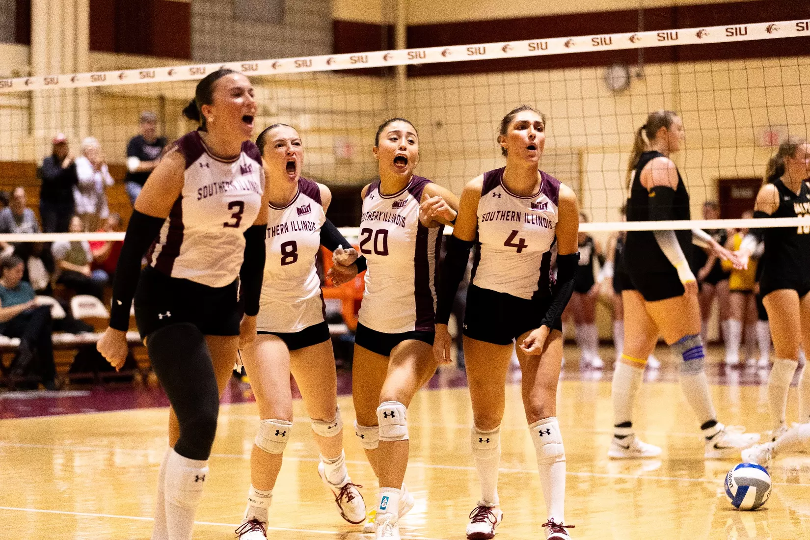The team celebrates after a point.