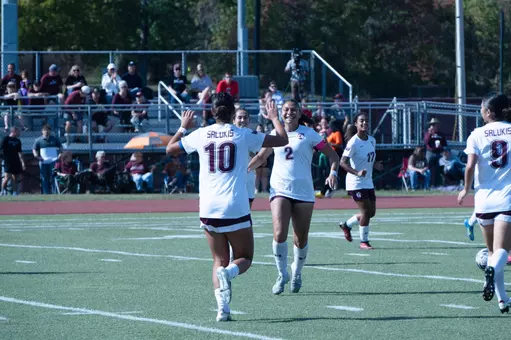Dana Nadda and Maya Dixon celebrating Dixon's first goal of the day against Drake