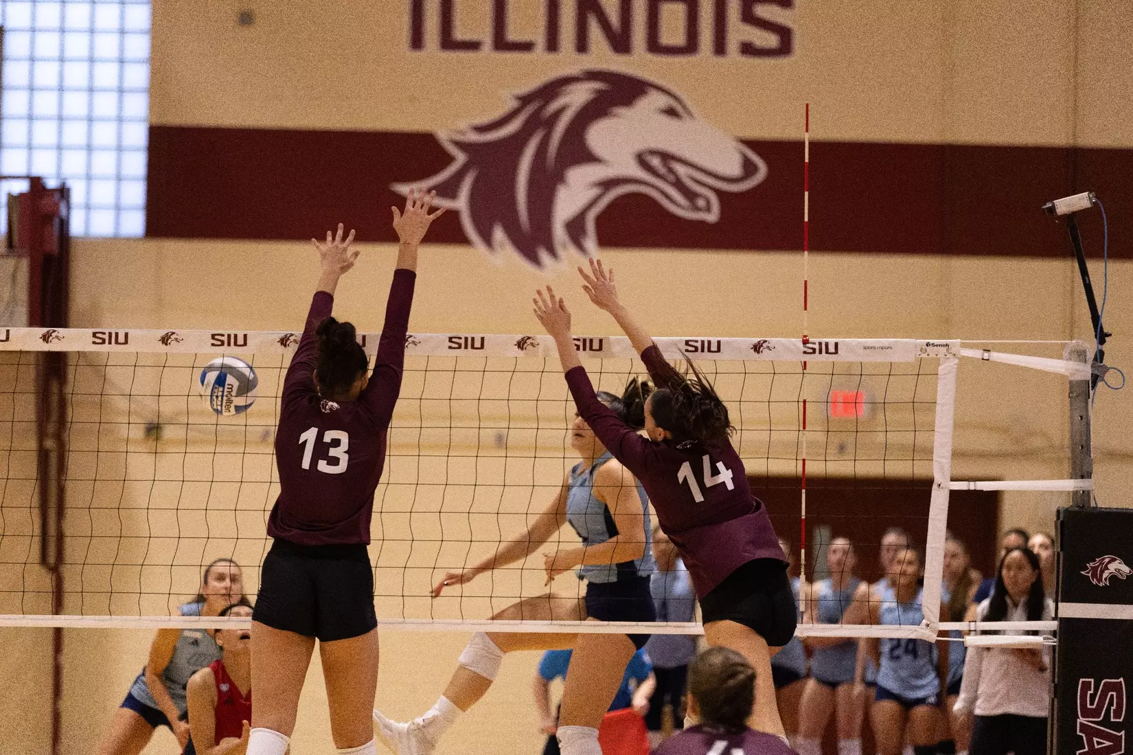 Beatriz Piaia and Ella Swansiger go up for a block.