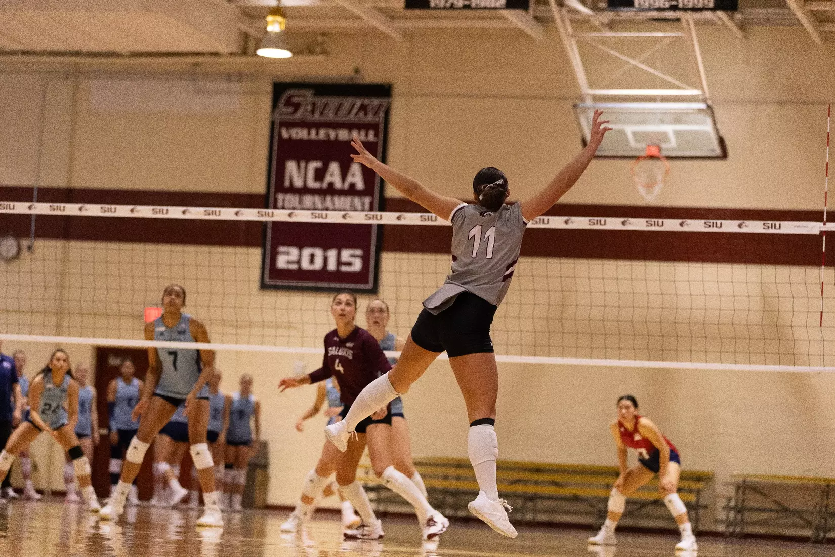Jillian Shaneyfelt reaches out after setting a ball.